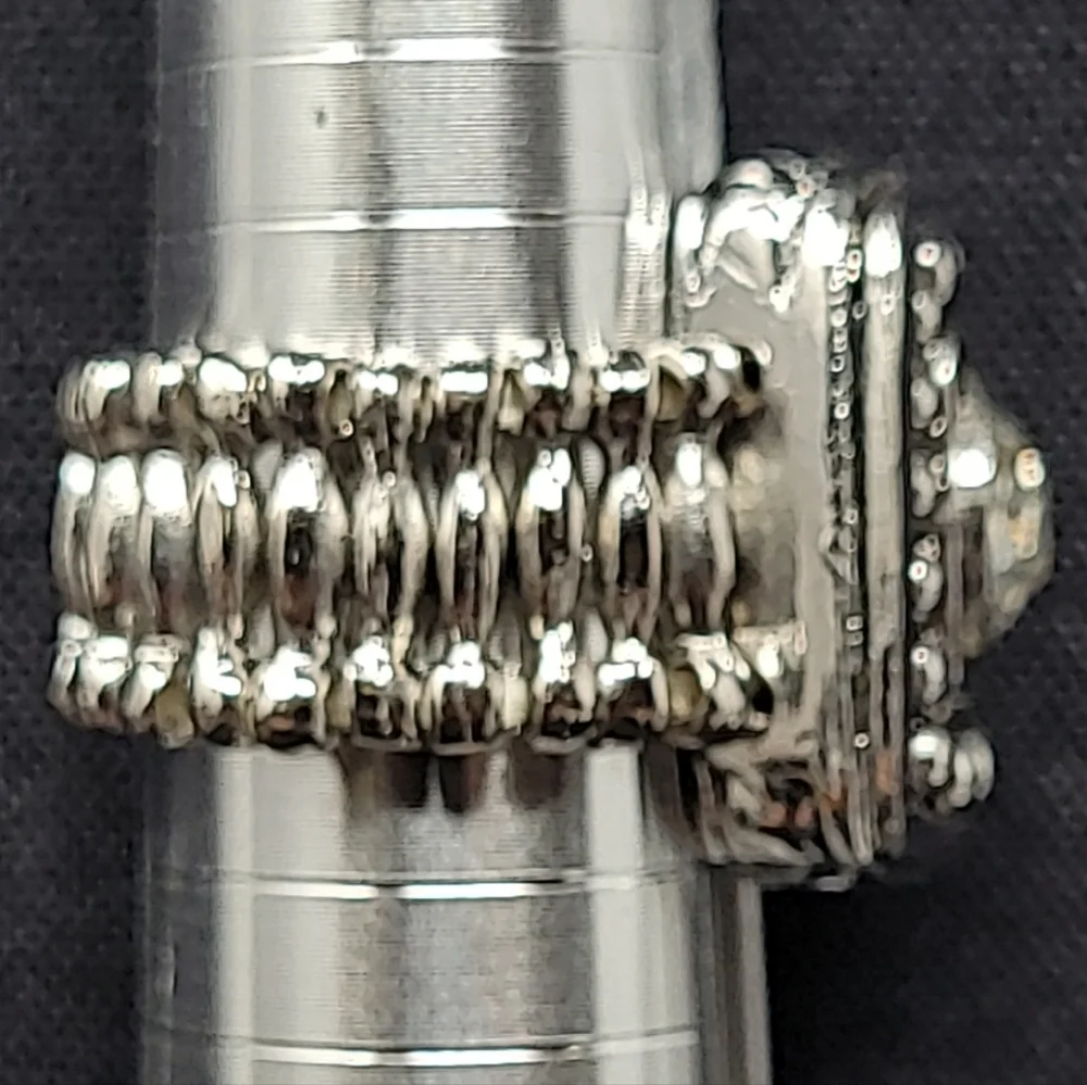 SILVER TONE METAL WITH A LARGE CLEAR RHINESTONE STRETCH RING (COSTUME JEWELRY)